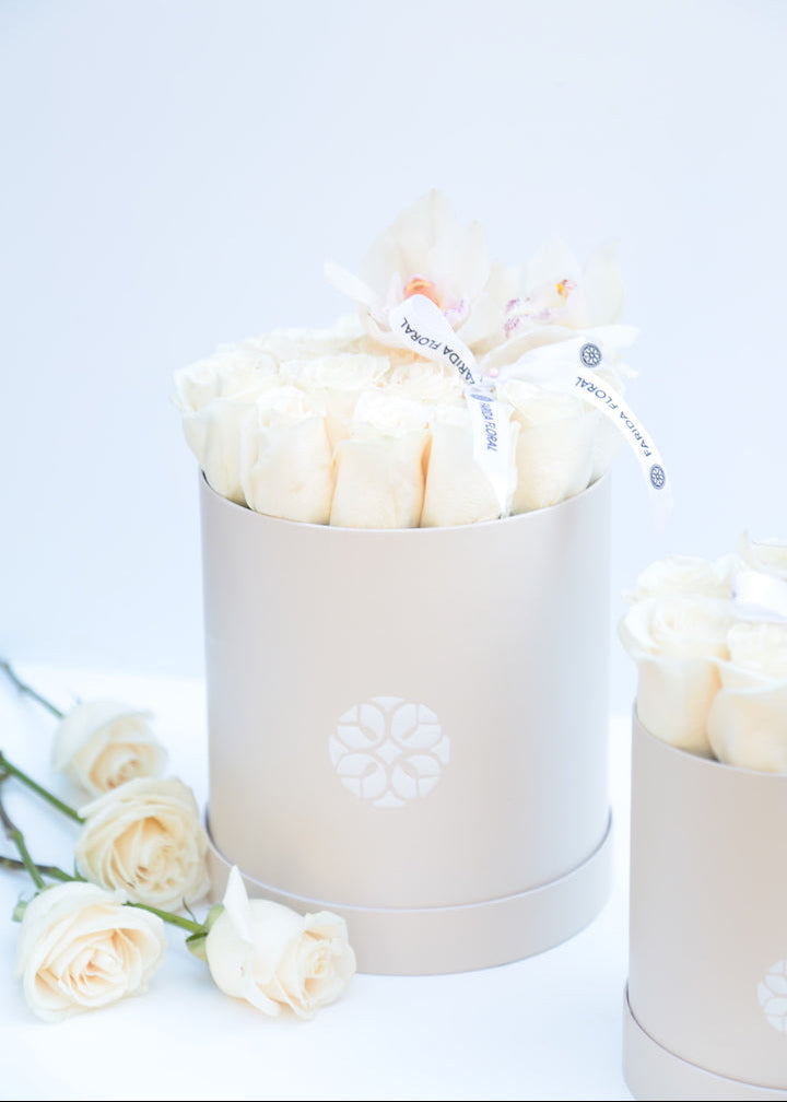 Ivory classic roses hand-arranged by Farida Floral in Fairfax VA