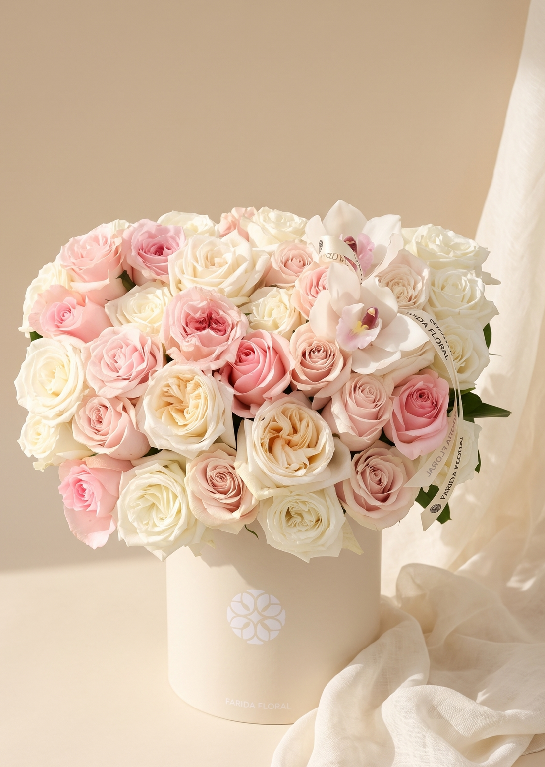 Assorted rose colors in a signature arrangement by Farida Floral