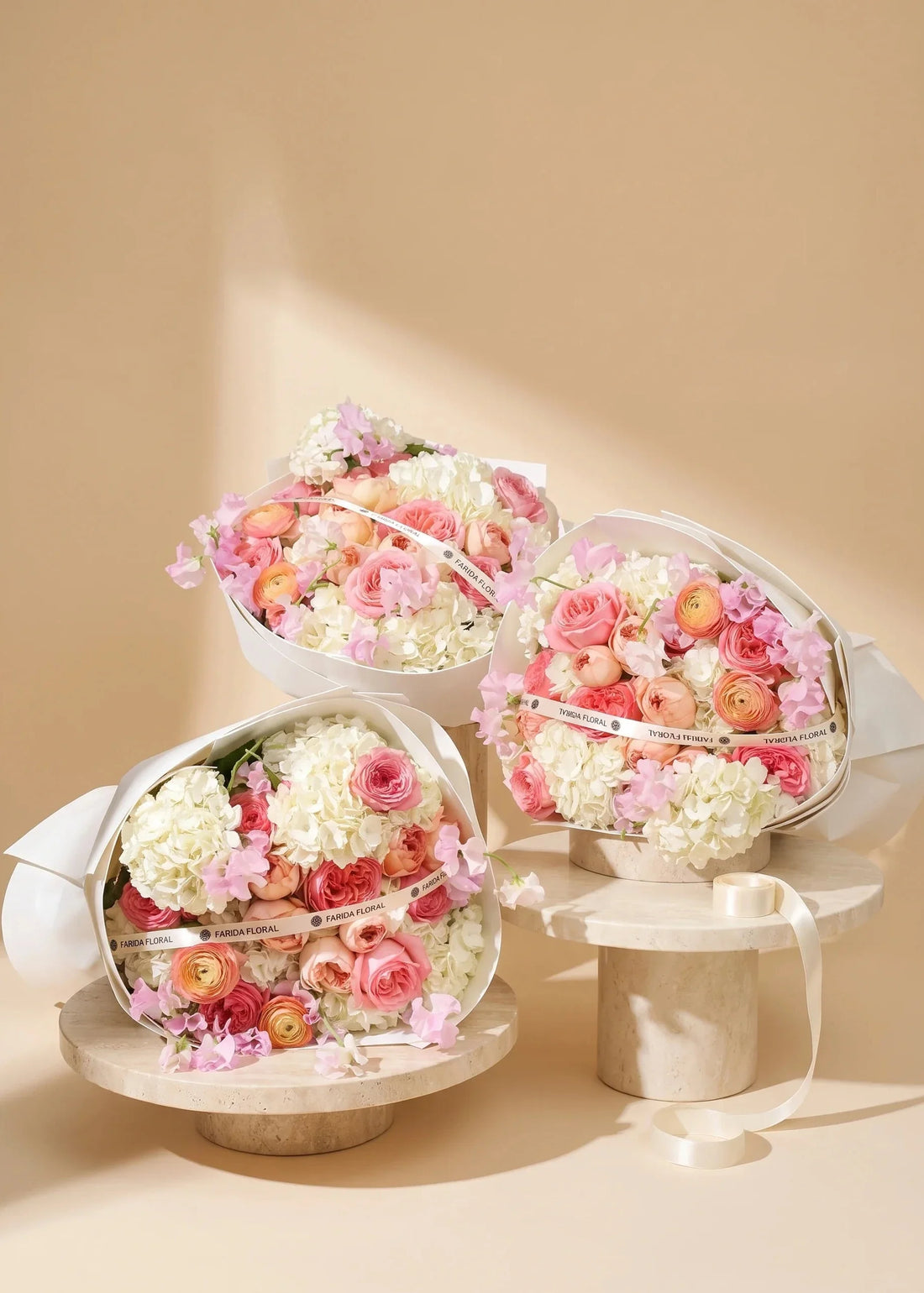Hand-tied hydrangea rose bouquet with jumbo white hydrangeas by Farida Floral, Fairfax VA