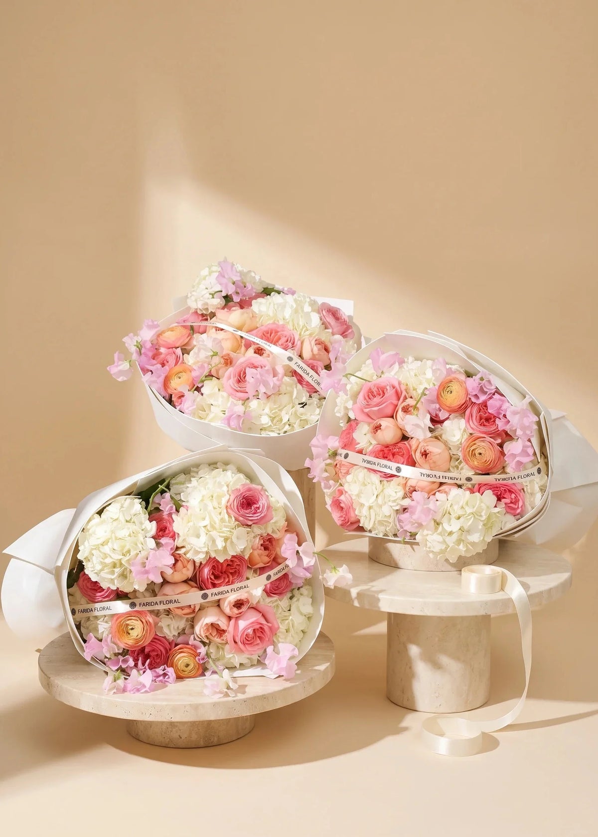 Hand-tied hydrangea rose bouquet with jumbo white hydrangeas by Farida Floral, Fairfax VA