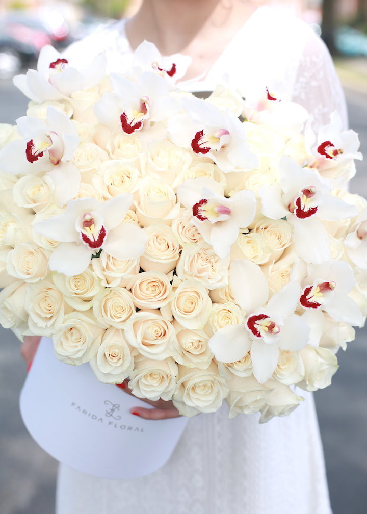 Ivory rose sympathy arrangement in a keepsake box by Farida Floral, Fairfax VA